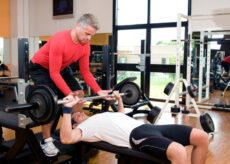 Chest press with personal trainer